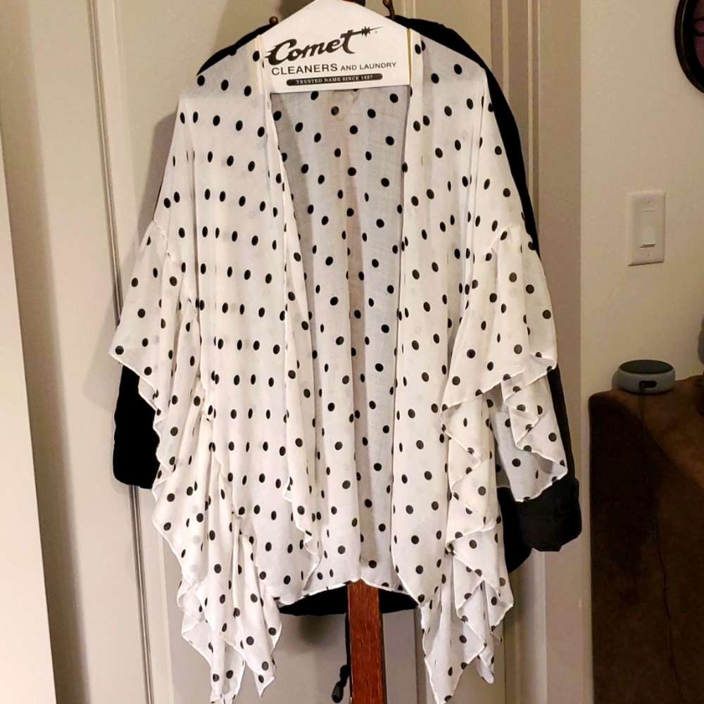 Throw on white and black polka dot type jacket
